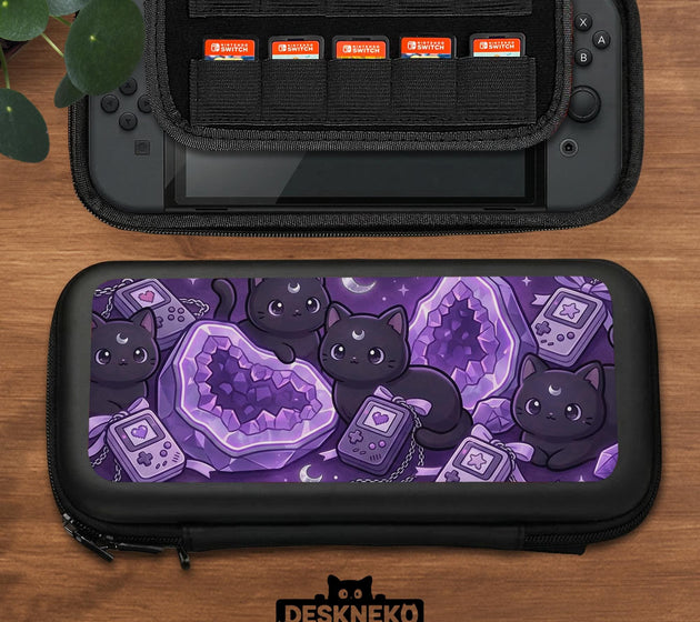 Purple carrying case with black cat faces, moon shapes, stars, and crystal geode style artwork for Nintendo Switch.