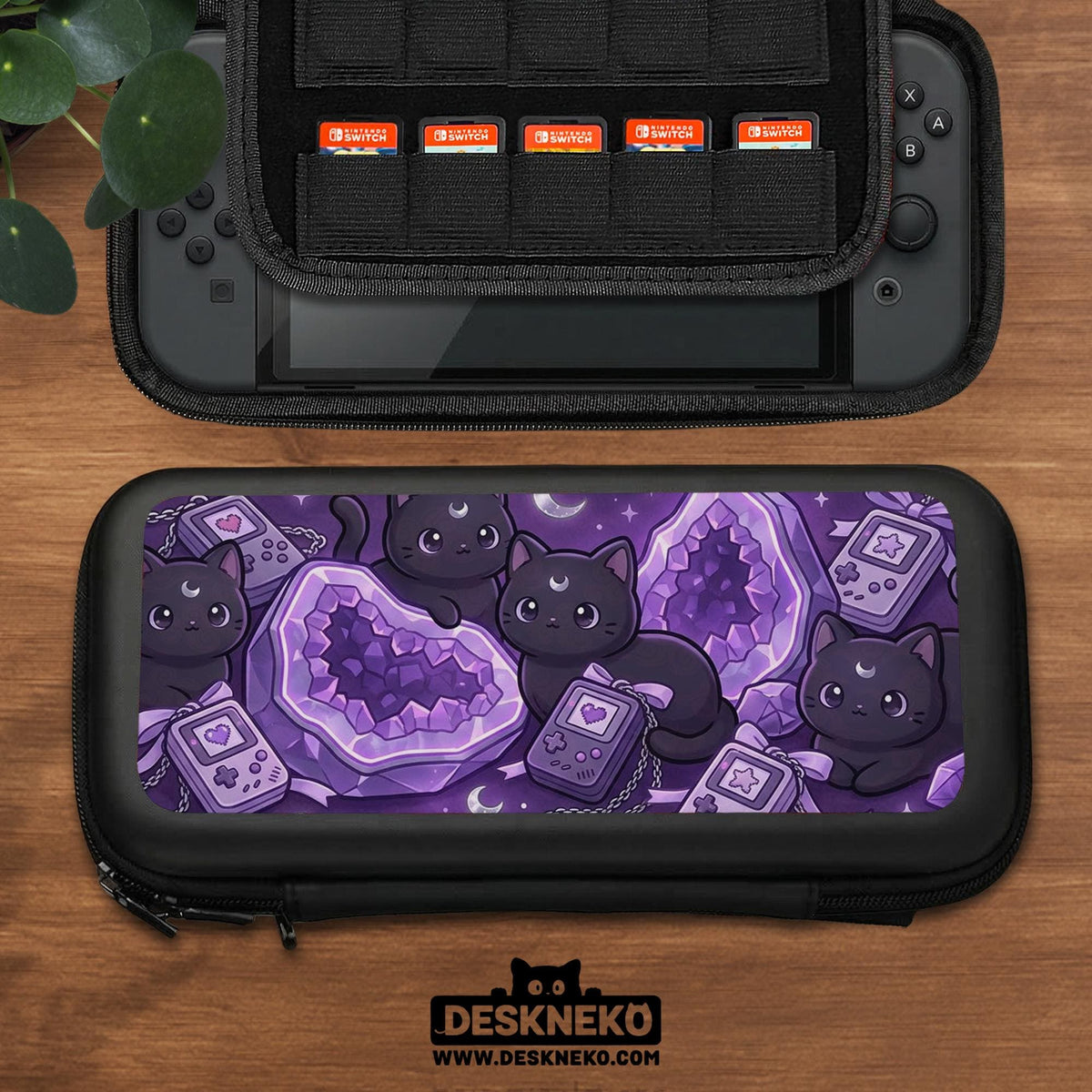 Purple carrying case with black cat faces, moon shapes, stars, and crystal geode style artwork for Nintendo Switch.
