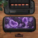 Purple carrying case with black cat faces, moon shapes, stars, and crystal geode style artwork for Nintendo Switch.