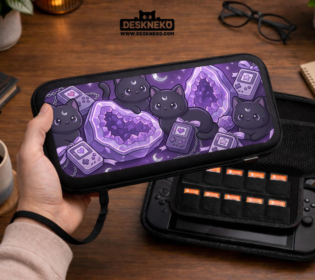 Purple carrying case with black cat faces, moon shapes, stars, and crystal geode style artwork for Nintendo Switch.
