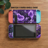 Purple carrying case with black cat faces, moon shapes, stars, and crystal geode style artwork for Nintendo Switch.