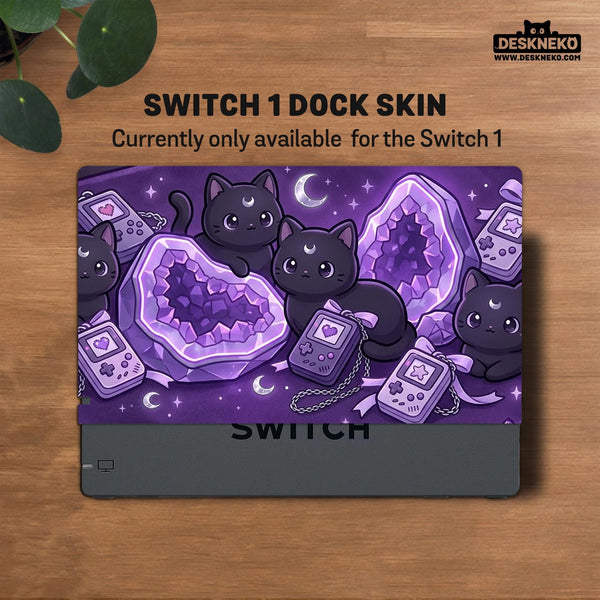 Purple carrying case with black cat faces, moon shapes, stars, and crystal geode style artwork for Nintendo Switch.