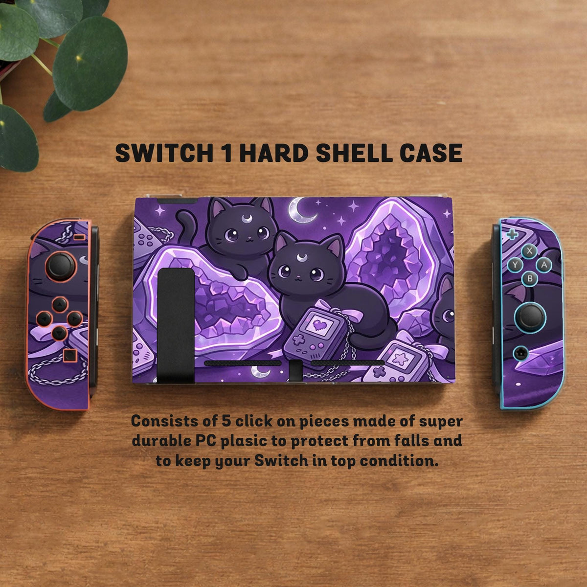 Purple carrying case with black cat faces, moon shapes, stars, and crystal geode style artwork for Nintendo Switch.