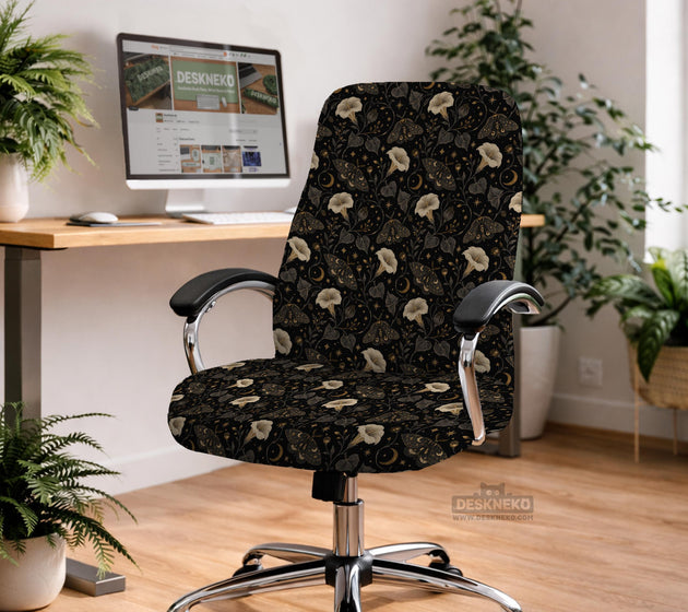Black chair cover with a moth, moon, and flower pattern in gold, ivory, and dark botanical tones.