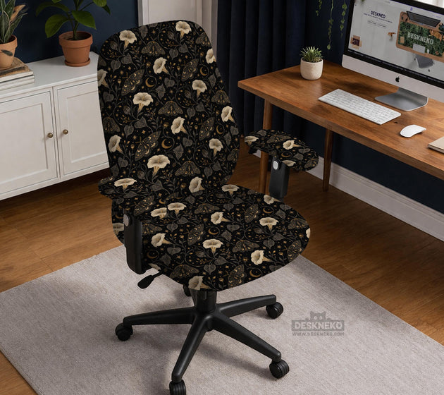 Black chair cover with a moth, moon, and flower pattern in gold, ivory, and dark botanical tones.