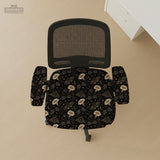 Black chair cover with a moth, moon, and flower pattern in gold, ivory, and dark botanical tones.