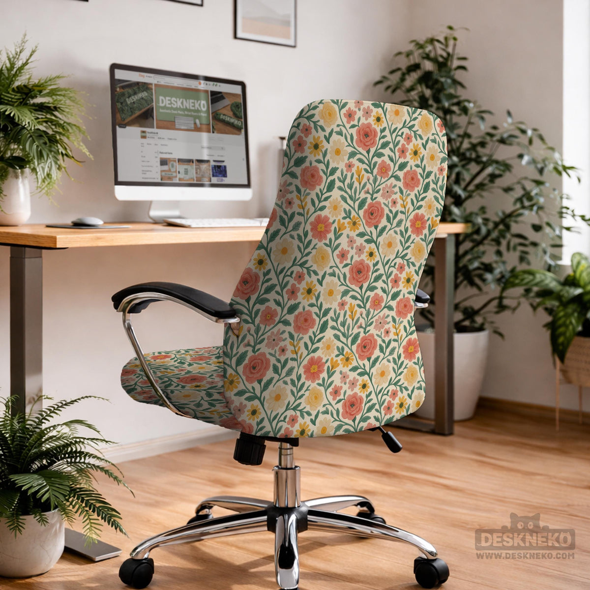 Cream desk chair cover with a vintage floral print featuring coral roses, mustard daisies, and green vines on a chair.