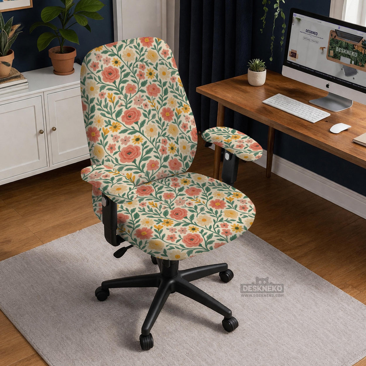 Cream desk chair cover with a vintage floral print featuring coral roses, mustard daisies, and green vines on a chair.