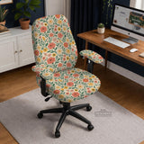 Cream desk chair cover with a vintage floral print featuring coral roses, mustard daisies, and green vines on a chair.