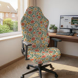 Cream desk chair cover with a vintage floral print featuring coral roses, mustard daisies, and green vines on a chair.
