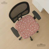 Pink chair cover with a botanical floral print shown on an office chair, with matching armrest covers and multiple cover style options.