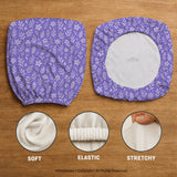 Purple desk chair cover with a botanical floral pattern shown in multiple slipcover options for full chair, back and seat, seat-only, and armrest-only coverage.