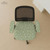 Green chair cover with a small botanical floral print in sage and cream.