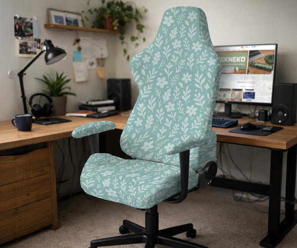 Sage and aqua green floral chair cover shown on a gaming chair with matching armrest covers.