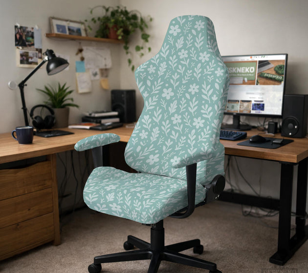 Mint and white botanical desk chair cover with a floral leaf pattern shown on an office chair.