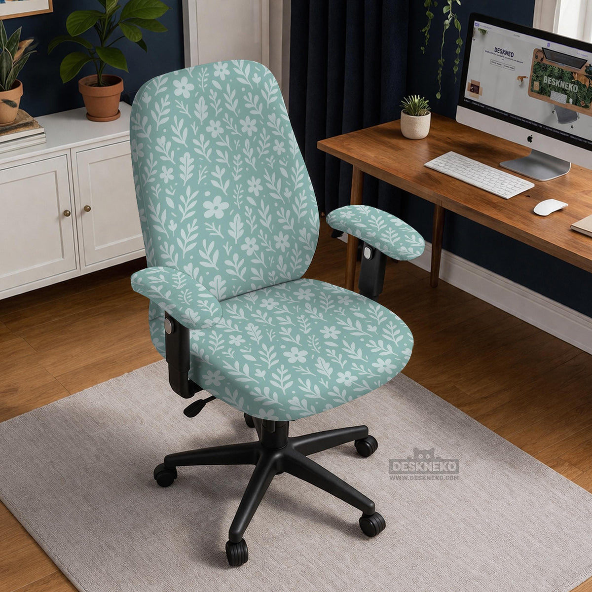 Mint and white botanical desk chair cover with a floral leaf pattern shown on an office chair.