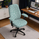 Mint and white botanical desk chair cover with a floral leaf pattern shown on an office chair.