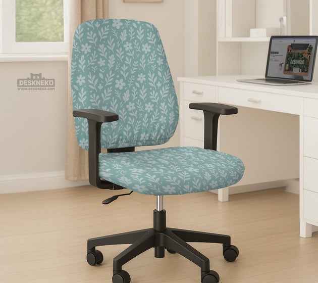Mint and white botanical desk chair cover with a floral leaf pattern shown on an office chair.