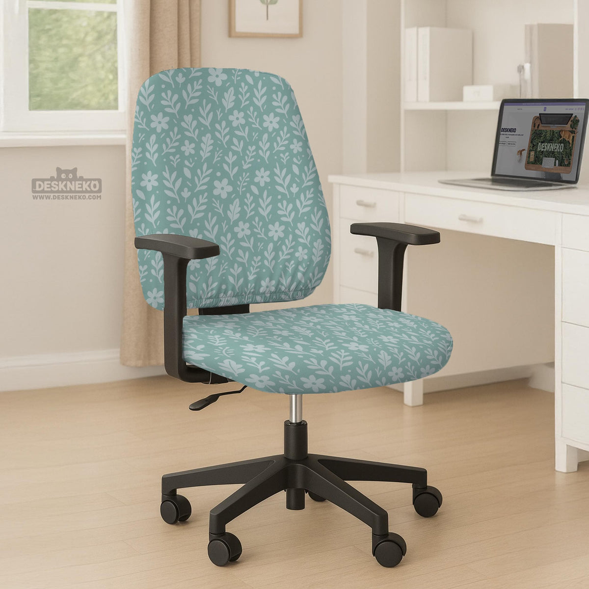 Mint and white botanical desk chair cover with a floral leaf pattern shown on an office chair.