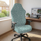 Mint and white botanical desk chair cover with a floral leaf pattern shown on an office chair.