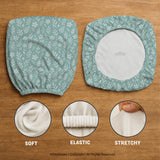 Mint and white botanical desk chair cover with a floral leaf pattern shown on an office chair.