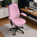 Blush pink chair cover with a small botanical floral pattern shown on an office chair.