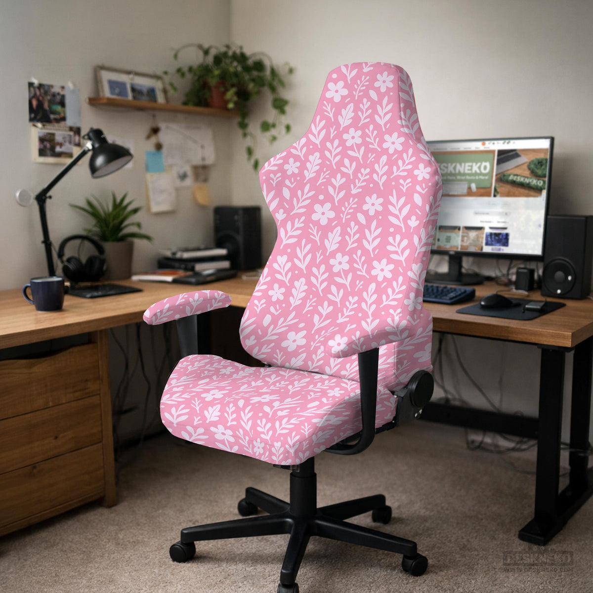 Blush pink chair cover with a small botanical floral pattern shown on an office chair.