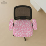 Soft pink floral chair cover shown on a gaming chair with a high back and armrests.
