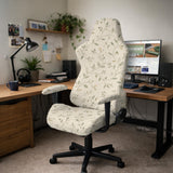 Cream floral chair covers with muted sage leaves and fine vine details on an ivory background, shown as multiple slipcover options for chair backs, seats, and armrests.