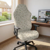 An ivory chair cover set with a subtle vine pattern shown on a black gaming chair, including cover options for the chair back, seat, and armrests.