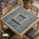 Blue mahjong mat with a dusty linen-look background and small leafy botanical stems in a floral pattern.