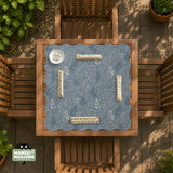 Blue mahjong mat with a dusty linen-look background and small leafy botanical stems in a floral pattern.