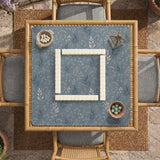 Blue mahjong mat with a dusty linen-look background and small leafy botanical stems in a floral pattern.
