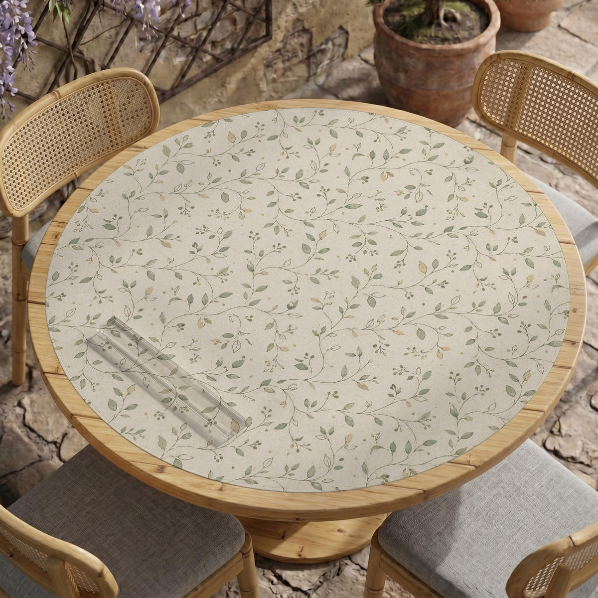 Sage green botanical mahjong mat with a cream background, trailing vines, and muted leaf designs.