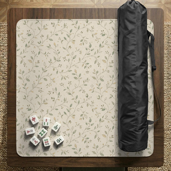Cream square mahjong mat with a sage vine and leaf botanical pattern and scalloped edges.