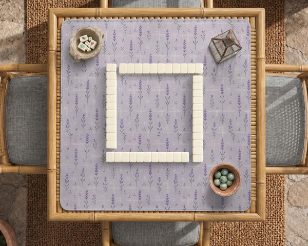Lavender mahjong mat with a pale purple background, small botanical sprigs, and fine grid lines.