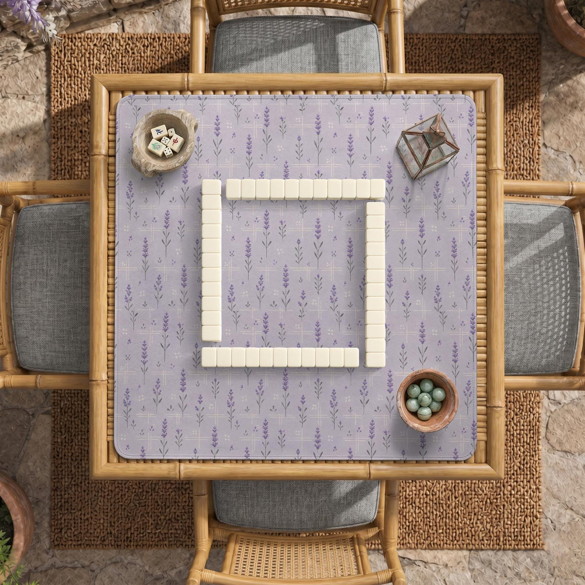 Lavender mahjong mat with a pale purple background, small botanical sprigs, and fine grid lines.