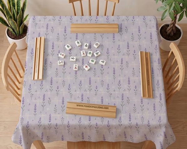 Lavender mahjong mat with a pale purple background, small botanical sprigs, and fine grid lines.