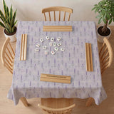 Lavender mahjong mat with a pale purple background, small botanical sprigs, and fine grid lines.