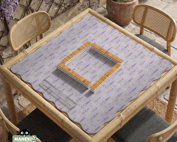Lavender mahjong mat with a pale purple background, small botanical sprigs, and fine grid lines.
