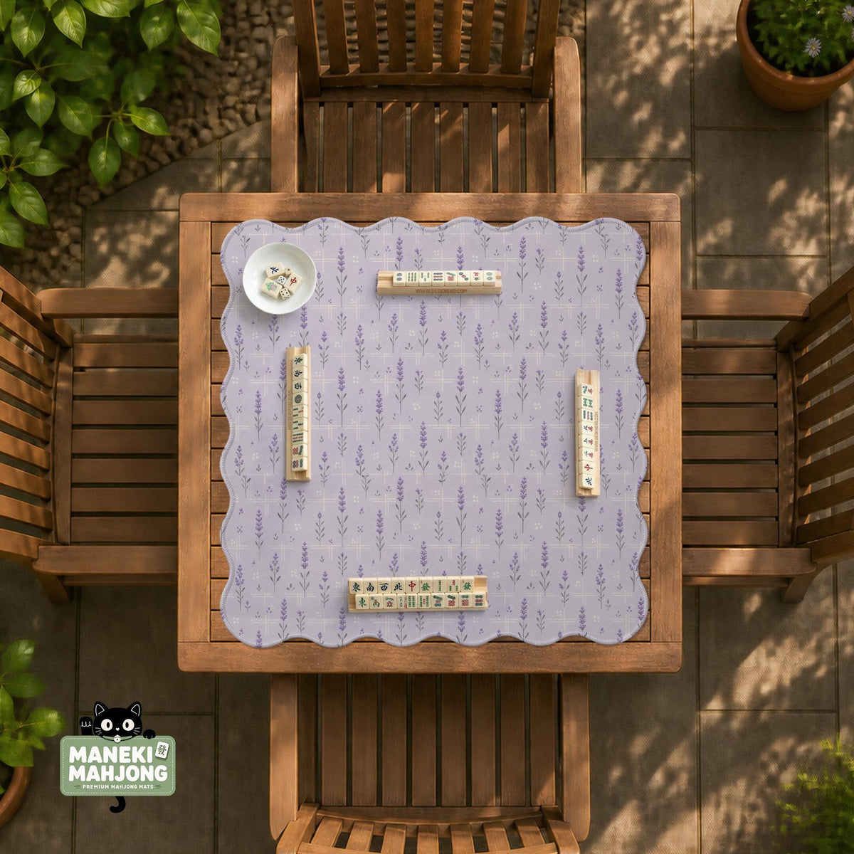 Lavender mahjong mat with a pale purple background, small botanical sprigs, and fine grid lines.