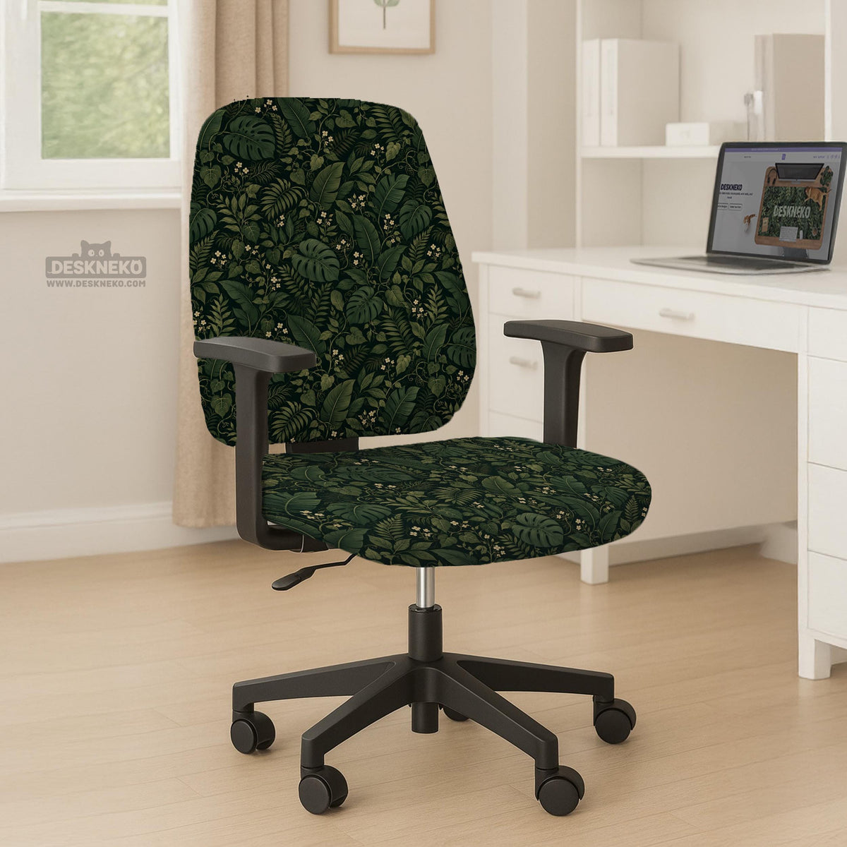 Forest green chair cover with a tropical leaf pattern featuring monstera leaves and small cream flowers.