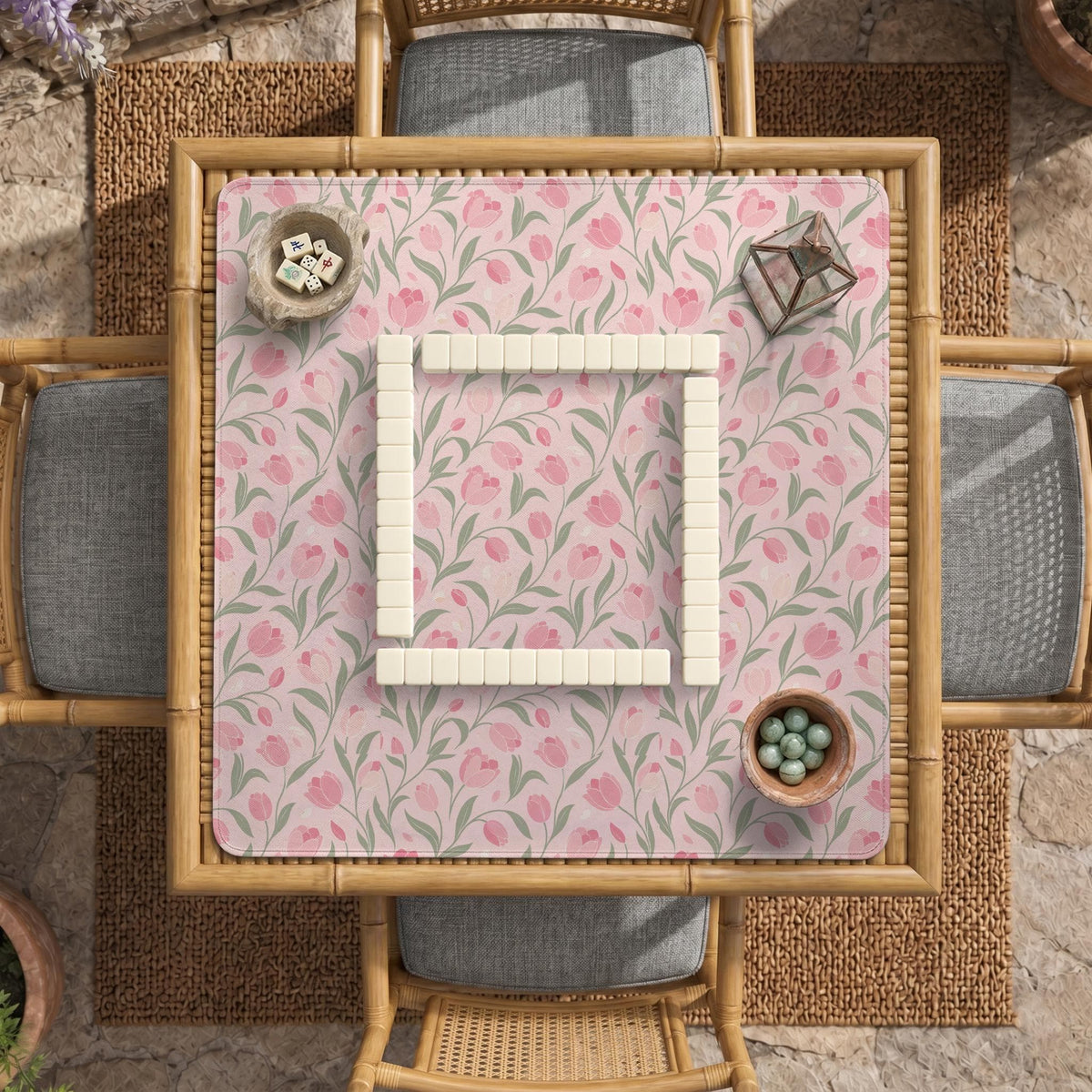 Pink mahjong mat with a tulip floral pattern in blush and sage tones and a scalloped edge.