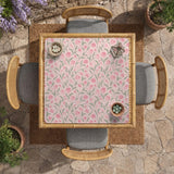 Pink mahjong mat with a tulip floral pattern in blush and sage tones and a scalloped edge.