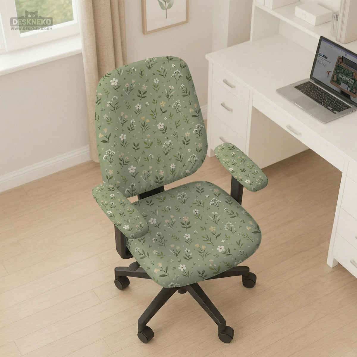Sage green chair cover with a small floral print shown on a desk chair with a high back.