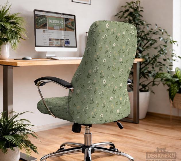 Sage green chair cover with a small floral print shown on a desk chair with a high back.