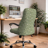 Sage green chair cover with a small floral print shown on a desk chair with a high back.