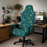 Blue green chair cover with a peacock feather pattern shown on an office chair, with fitted stretch fabric and armrest coverage visible in the listing image.
