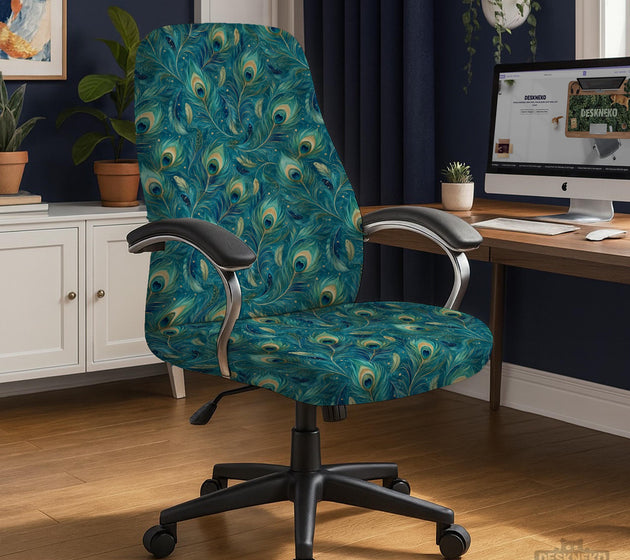 A blue green chair cover with a peacock feather design shown on an office chair with armrests.