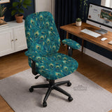 Blue green chair cover with a peacock feather pattern shown on an office chair, with fitted stretch fabric and armrest coverage visible in the listing image.